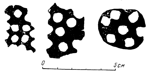 Illustration 4: Plate fragments, from which blanks have been cut out for chasing bells or buttons.