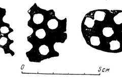 Illustration 4: Plate fragments, from which blanks have been cut out for chasing bells or buttons.