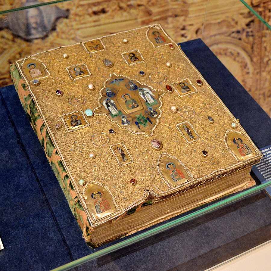 The cover and binding on the Mstislav Gospel (Rus. Мстиславово Евангелие). The manuscript dates to the 12th century. The luxurious cover (Rus. оклад, oklad) was added in the 16th century by order of Ivan the Terrible, and includes several enameled miniatures from the 10th-12th centuries, along with gemstones and pearls. Photo in public domain.